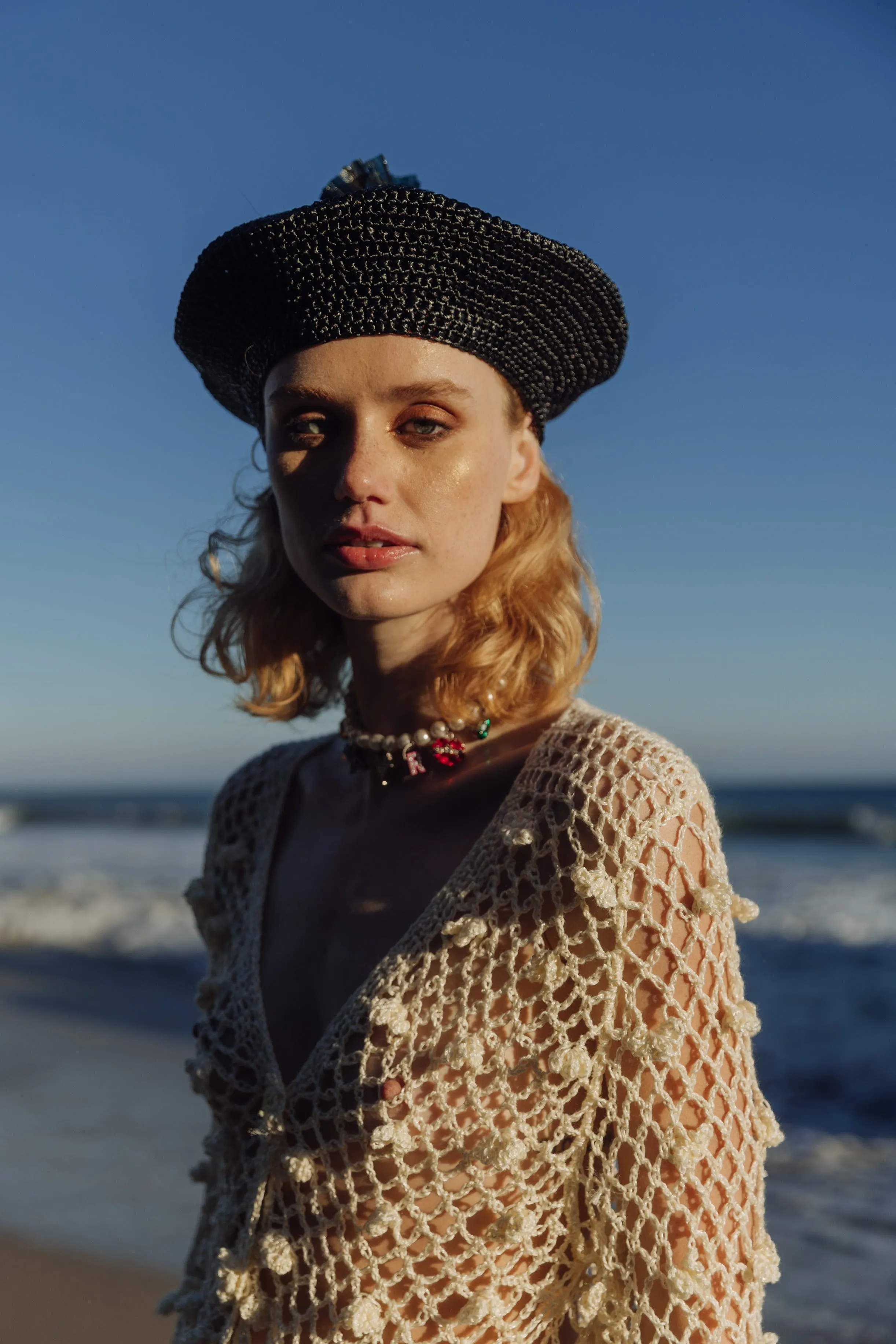 Beige raffia beret hat by Aliya Zhamantayeva