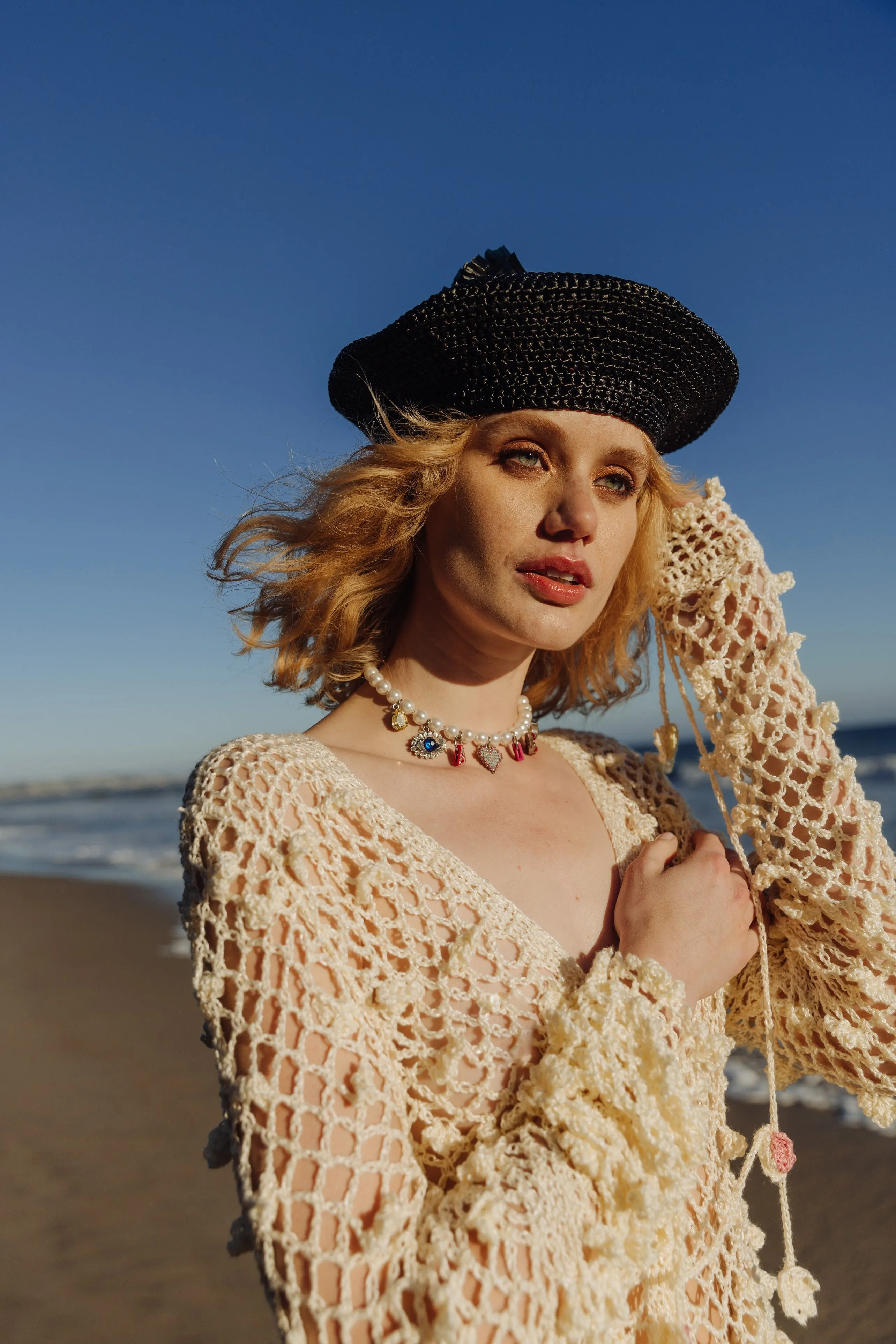 Beige raffia beret hat by Aliya Zhamantayeva